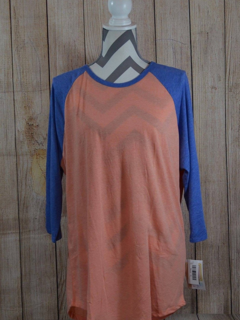 LuLaRoe Peach Front with Blue Raglan Sleeves Top